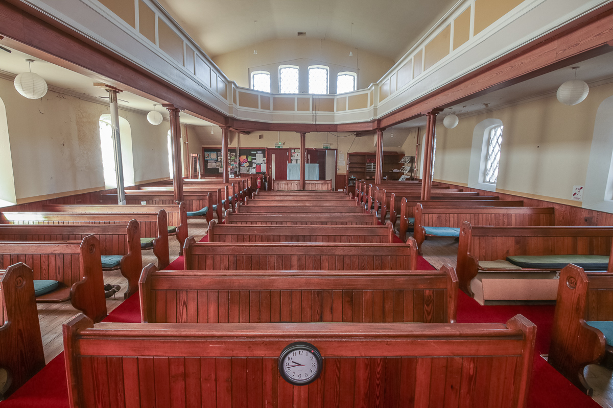 Inside of church looking to the back before pews were removed